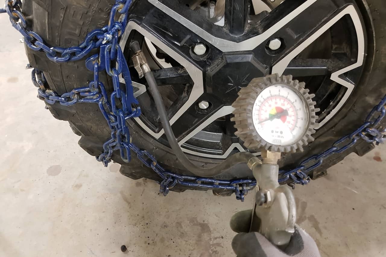 install atv tire chains reinflate tire